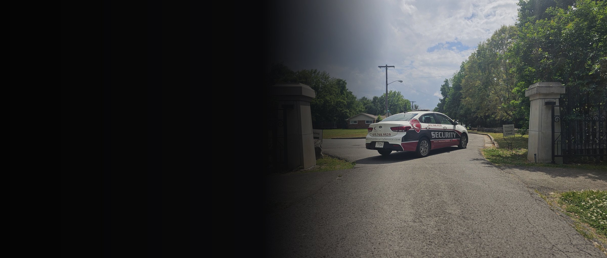 Crimson Security patrol vehicle at a gated community entrance