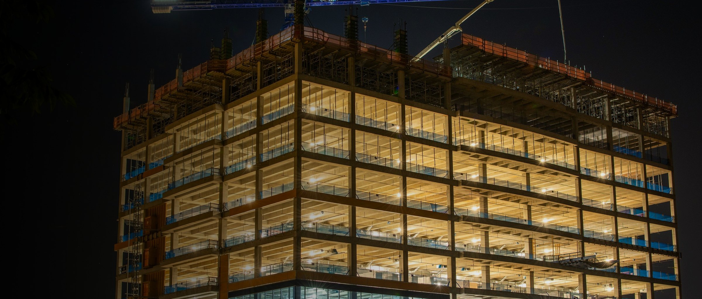 Building under construction lit at night